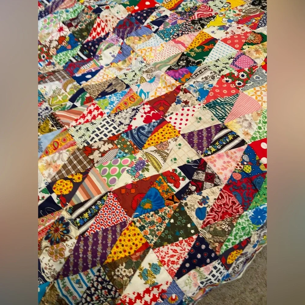 Vintage hand made quilt triangular fabric with solid reverse side